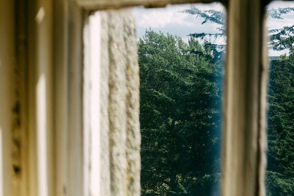 Beautiful landscape viewed through clear window highlighting focus